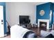 Living room with fireplace, TV, and hardwood floors at 3150 Soft Breezes Dr # 2025, Las Vegas, NV 89128