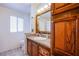 Bathroom with granite vanity and linen cabinet at 3209 Tularosa Ln, Las Vegas, NV 89122