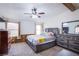 Main bedroom with king-size bed and ceiling fan at 3209 Tularosa Ln, Las Vegas, NV 89122