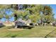 Serene community lawn with mature trees and seating at 3209 Tularosa Ln, Las Vegas, NV 89122