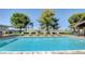 Inviting community pool with lounge chairs and covered patio at 3209 Tularosa Ln, Las Vegas, NV 89122