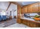 Dining area with wood cabinets and a view into the living room at 3209 Tularosa Ln, Las Vegas, NV 89122