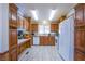 Bright kitchen with wood cabinets and tile floor at 3209 Tularosa Ln, Las Vegas, NV 89122