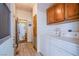 Bright laundry room with washer, dryer, and storage cabinets at 3209 Tularosa Ln, Las Vegas, NV 89122