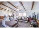 Spacious living room with sectional sofa and wood beams at 3209 Tularosa Ln, Las Vegas, NV 89122