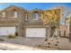 Inviting two-story townhouse featuring a two-car garage, and low maintenance desert landscaping at 374 Yellow Finch Ln, Henderson, NV 89012