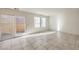 Living area with sliding glass door to a backyard patio at 374 Yellow Finch Ln, Henderson, NV 89012