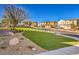 Charming neighborhood street featuring well-manicured lawns, landscaping, and varied home styles at 374 Yellow Finch Ln, Henderson, NV 89012