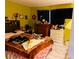 Bedroom with double bed and dresser, yellow walls at 4130 Balboa Ave, Las Vegas, NV 89121