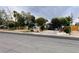 Charming single-story home with a lush, tree-filled front yard and a long driveway at 4130 Balboa Ave, Las Vegas, NV 89121