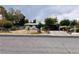 Cozy single-story home featuring mature trees, a secure fence, and a convenient covered parking area at 4130 Balboa Ave, Las Vegas, NV 89121