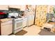 Galley style kitchen with granite countertops and white cabinets at 4130 Balboa Ave, Las Vegas, NV 89121