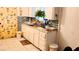 Kitchen with granite countertops, white cabinets and tile backsplash at 4130 Balboa Ave, Las Vegas, NV 89121