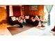 Living room featuring a sectional sofa and wood paneling at 4130 Balboa Ave, Las Vegas, NV 89121
