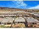 Gorgeous aerial view of a residential neighborhood showcasing backyard patios and desert landscape at 4331 Via Gallo Ct # 1, Pahrump, NV 89061