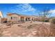 Large backyard showcasing the home's exterior and landscaping on a sunny day with blue skies at 4331 Via Gallo Ct # 1, Pahrump, NV 89061