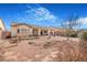 Large backyard showcasing the home's exterior and landscaping on a sunny day with blue skies at 4331 Via Gallo Ct # 1, Pahrump, NV 89061
