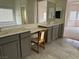 Bathroom featuring dual sinks and vanity with gray cabinetry, tile flooring, and vanity area at 4331 Via Gallo Ct # 1, Pahrump, NV 89061