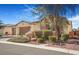 Single story home exterior with three car garage and desert landscaping at 4331 Via Gallo Ct # 1, Pahrump, NV 89061