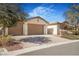 A home featuring a three-car garage with brick paved driveway and desert landscaping at 4331 Via Gallo Ct # 1, Pahrump, NV 89061