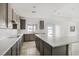 Bright kitchen featuring gray cabinets, stainless steel appliances, large island, and tile flooring at 4331 Via Gallo Ct # 1, Pahrump, NV 89061
