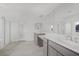 Bright main bathroom features double sinks, vanity area, large mirror, and tiled floor at 4331 Via Gallo Ct # 1, Pahrump, NV 89061