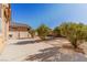 Small backyard with gravel, bushes, and patio at 5373 Sleeping Cat St, Las Vegas, NV 89122