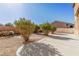 Landscaped backyard with patio and gravel at 5373 Sleeping Cat St, Las Vegas, NV 89122