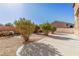 Landscaped backyard with a patio and gravel at 5373 Sleeping Cat St, Las Vegas, NV 89122