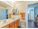 Double vanity bathroom with view of hallway at 5373 Sleeping Cat St, Las Vegas, NV 89122