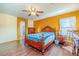 Main bedroom with hardwood floors and a ceiling fan at 5373 Sleeping Cat St, Las Vegas, NV 89122