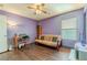 Bedroom with futon, desk, and wood flooring at 5373 Sleeping Cat St, Las Vegas, NV 89122