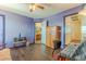 Bedroom with built-in wood wardrobe and loft access at 5373 Sleeping Cat St, Las Vegas, NV 89122