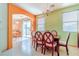 Elegant dining room with a wood table and chairs, plus access to backyard at 5373 Sleeping Cat St, Las Vegas, NV 89122