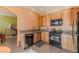 Kitchen boasts granite countertops and modern black appliances at 5373 Sleeping Cat St, Las Vegas, NV 89122