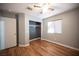 Bedroom with grey walls, wood-look floors, and a closet at 572 Decidedly St, Henderson, NV 89015