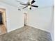 Bright bedroom with ceiling fan and gray carpet at 601 Cabrillo Cir # 1293, Henderson, NV 89015