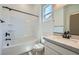 Well-lit bathroom with a shower/tub combo and a stylish vanity with great natural light at 63 Ibiza Lake Dr, Henderson, NV 89011