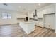 Bright kitchen showcasing a large island with bar seating, stainless appliances, and recessed lighting at 63 Ibiza Lake Dr, Henderson, NV 89011