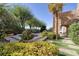 The lush backyard features well-maintained landscaping, a hot tub, and views of the surrounding area at 641 Saint Croix St, Henderson, NV 89012