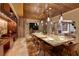 Spacious dining area with a stone table, modern lighting, and an exterior view at 641 Saint Croix St, Henderson, NV 89012