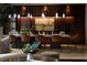 The elegant dining room features designer lighting, a long table, and stylish seating for sophisticated meals at 641 Saint Croix St, Henderson, NV 89012