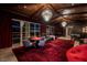 Spacious game room with foosball, poker table, comfy seating, and large windows overlooking the city lights at 641 Saint Croix St, Henderson, NV 89012