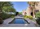 A serene hot tub area is surrounded by stone architecture and lush landscaping for a private retreat at 641 Saint Croix St, Henderson, NV 89012