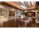 Elegant living room boasts hardwood floors, fireplace, designer ceiling, and seamless flow to dining at 641 Saint Croix St, Henderson, NV 89012