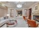 Elegant living room with fireplace, a view into the bedroom, and refined seating creates a harmonious space at 641 Saint Croix St, Henderson, NV 89012