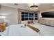 A tranquil bedroom features a large window overlooking city lights and sleek modern furniture at 641 Saint Croix St, Henderson, NV 89012