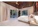 This light-filled main bedroom with outdoor access features a wood ceiling and neutral colors at 641 Saint Croix St, Henderson, NV 89012