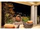 Inviting outdoor patio with stylish seating and a unique globe-shaped fire pit feature at 641 Saint Croix St, Henderson, NV 89012