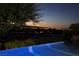 Capture serene evenings by the illuminated pool, gazing at the distant city lights and golf course views at 641 Saint Croix St, Henderson, NV 89012